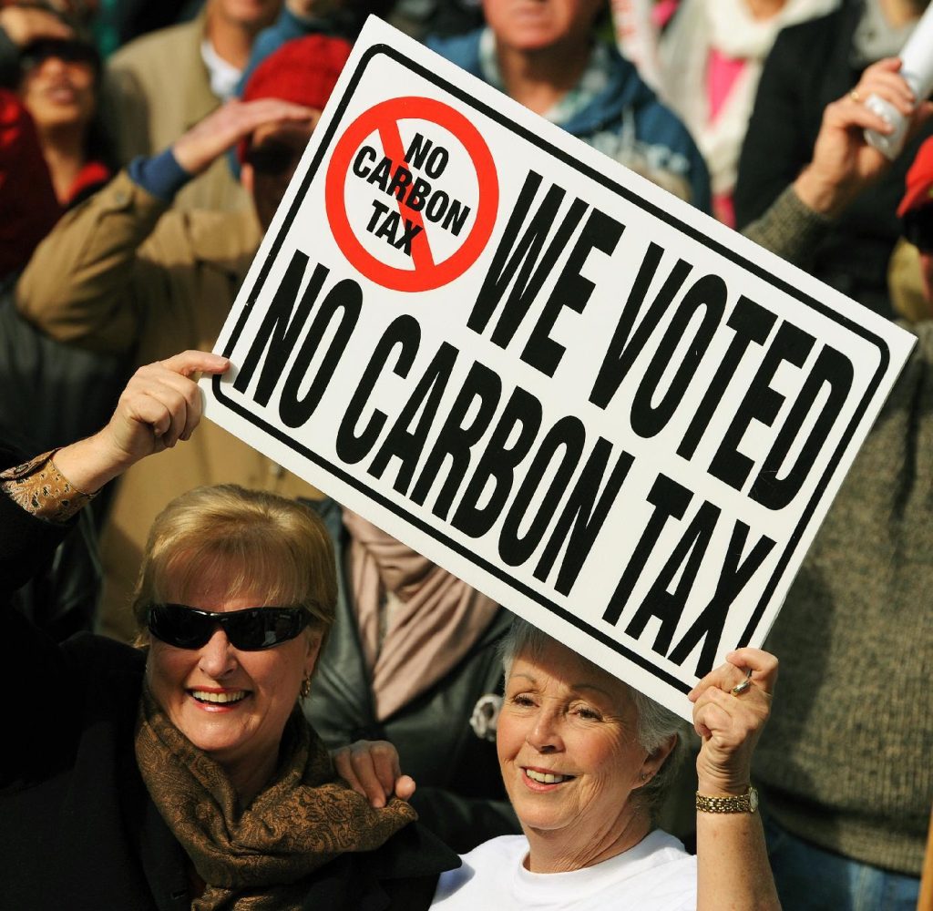 Protestors of the carbon tax in Australia. Not everyone is convinced of the merits of reducing emissions, often resulting in obstacles to emissions reduction incentives.
