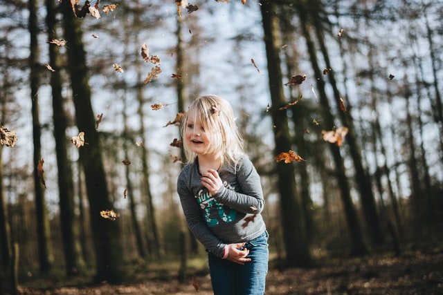 Nature play is unstructured, physical activity in natural settings. It builds children's imaginations, provides exercise and adventure, and helps them test their physical abilities.