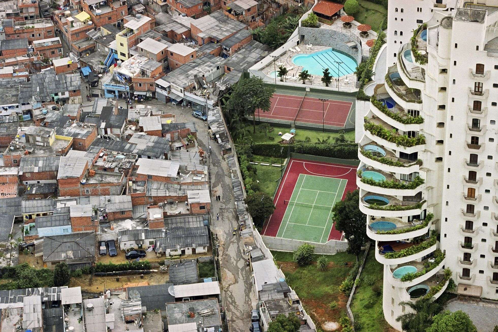 A favela next to a wealthy neighbourhood. Failure in Community sustainability initiatives leads to inequitable outcomes which make societies unsustainable.