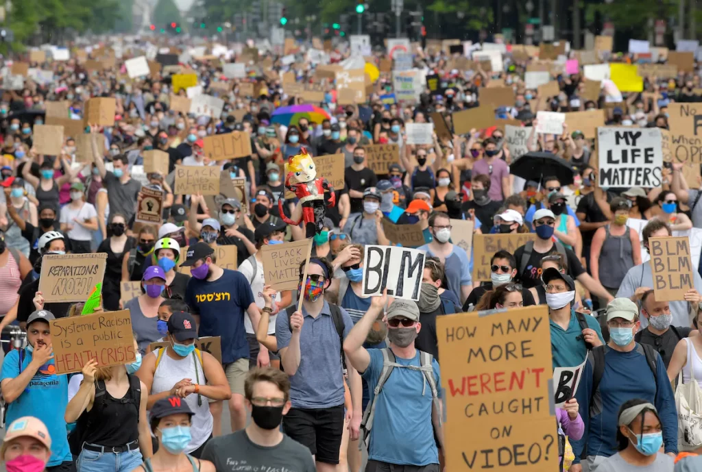BLM protestors march in June 2020. 