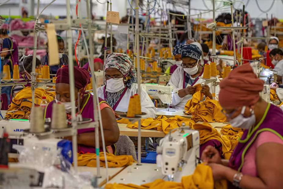 Workers sew garments in a Textile factory in Cape Town, South Africa.  