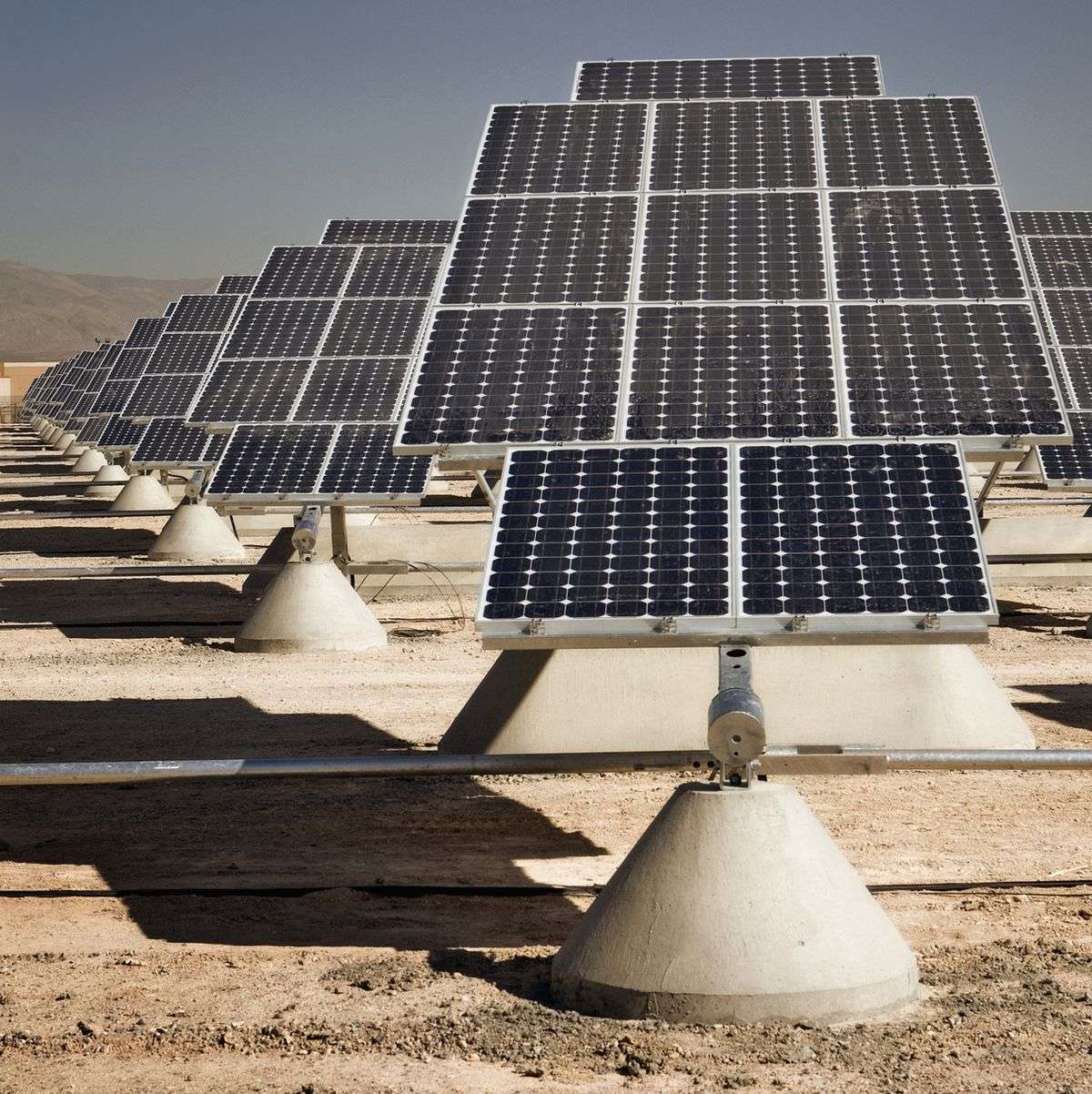 Solar panels mounted in a solar farm provide sustainable advances in solar energy.